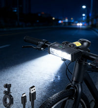 EcoBike LED front bike light mounted on mountain bike handlebars at night with USB Type-C cable and handlebar bracket — rechargeable bicycle headlight ships Australia-wide
