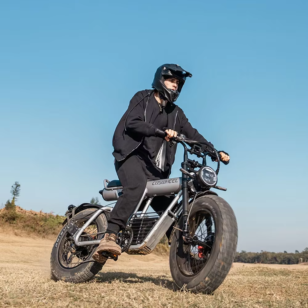 Rider on EcoBike Pro Max 2000W fat tyre electric bike riding off-road on open terrain wearing motocross helmet — powerful fat tyre e-bike for adventure riding Australia
